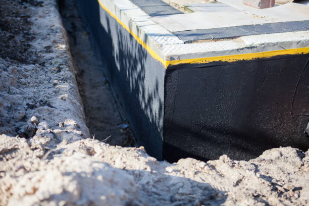 Professional Emergency Waterproofing technician working in Ashley, OH